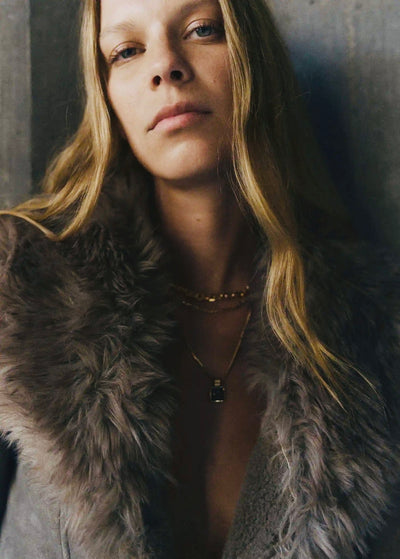 Veste effet daim et fausse fourrure